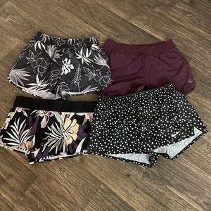 Set of 4 women’s running/athletic shorts Roxy, Nike, 2 carve design all large!